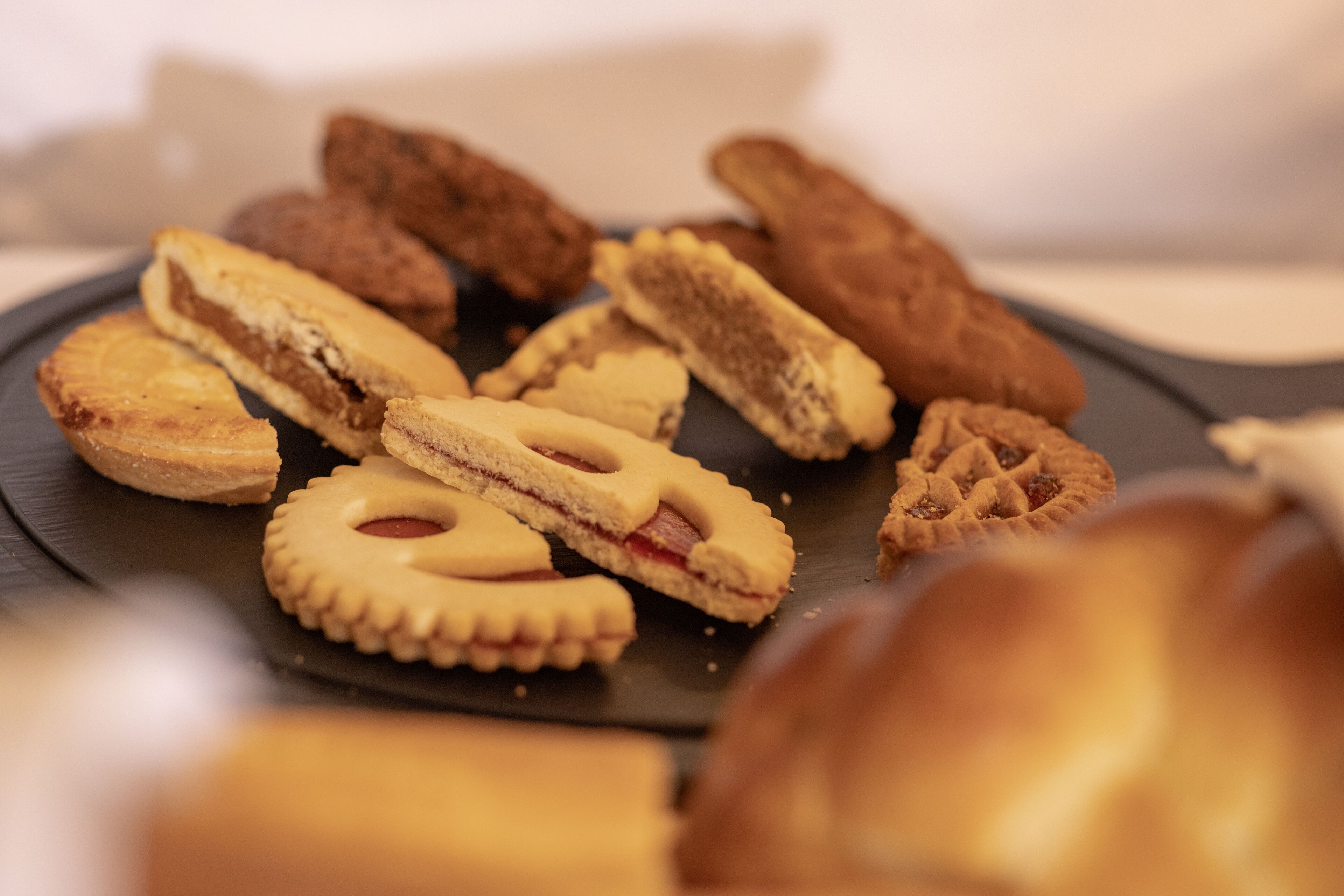 A variety of cookies on a plate.
