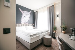 Ropa de cama de alta calidad, minibar, caja fuerte y escritorio