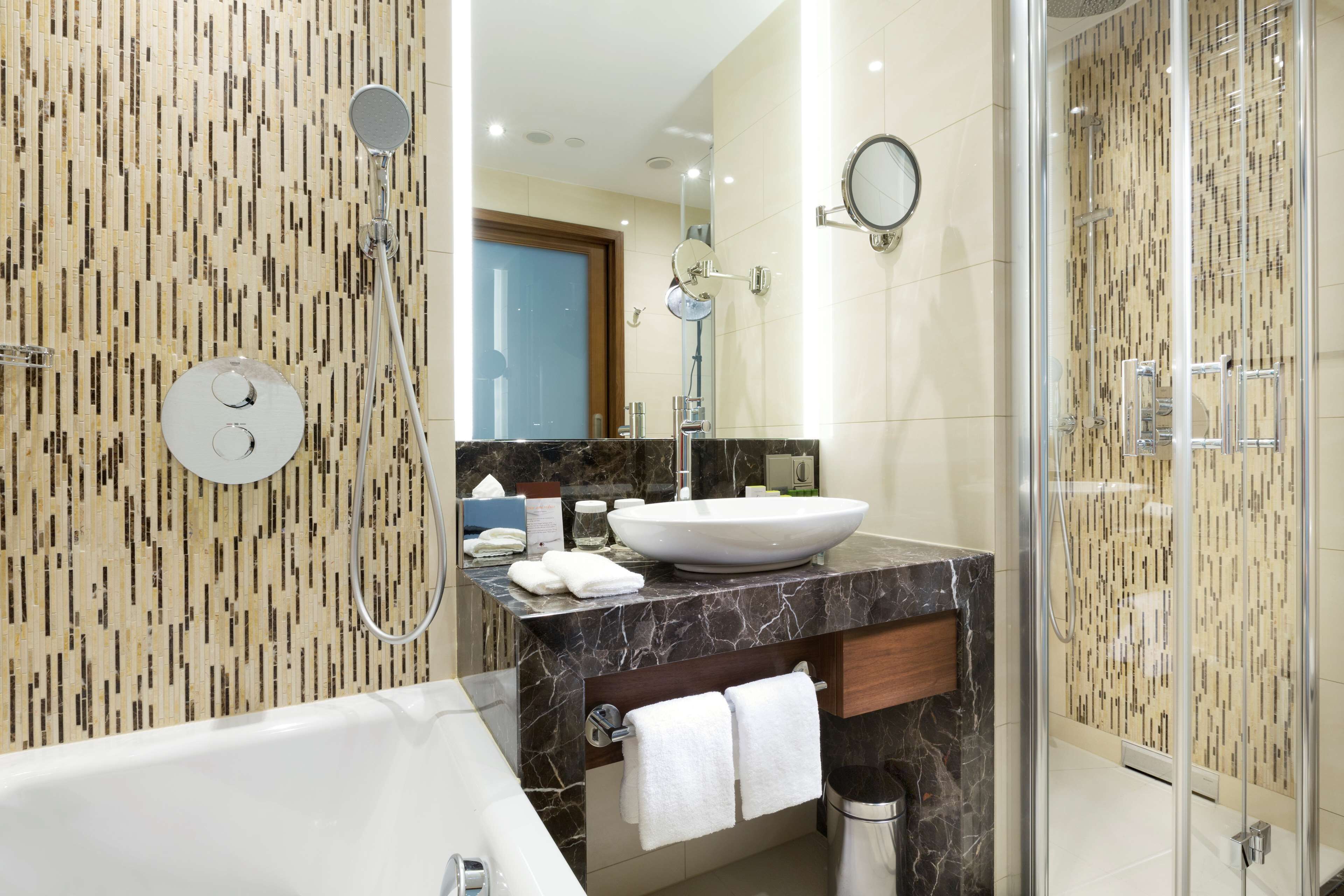 King, Suite, 1 Bedroom | Bathroom | Deep soaking tub, designer toiletries, hair dryer, slippers