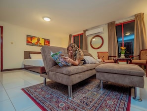 Premium Room, 1 King Bed, City View | In-room safe, desk, laptop workspace, blackout drapes