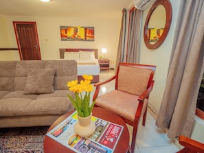 Premium Room, 1 King Bed, City View | In-room safe, desk, laptop workspace, blackout drapes
