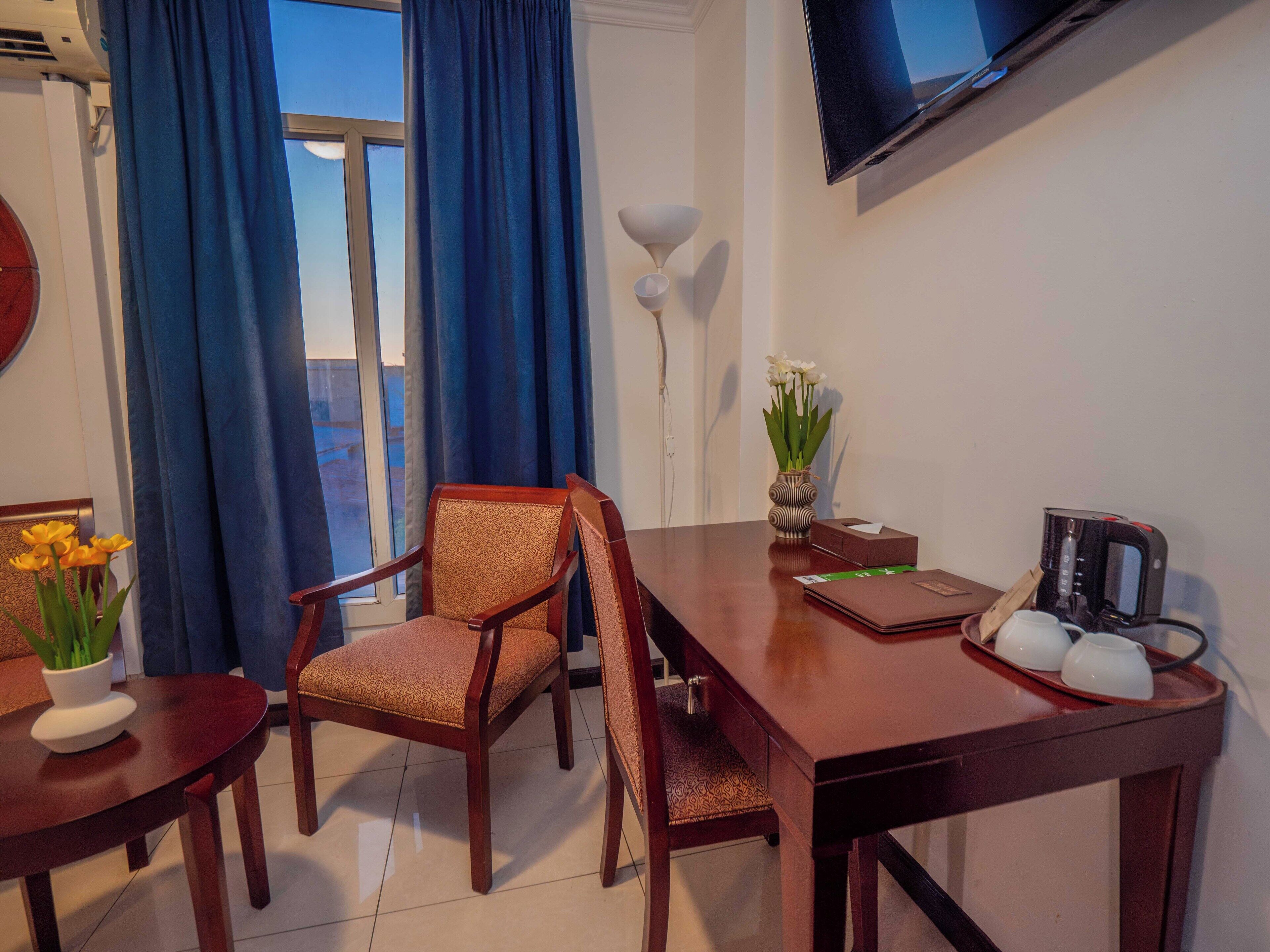 premium quadruple room, 2 queen beds | in-room safe, desk, laptop workspace, blackout curtains