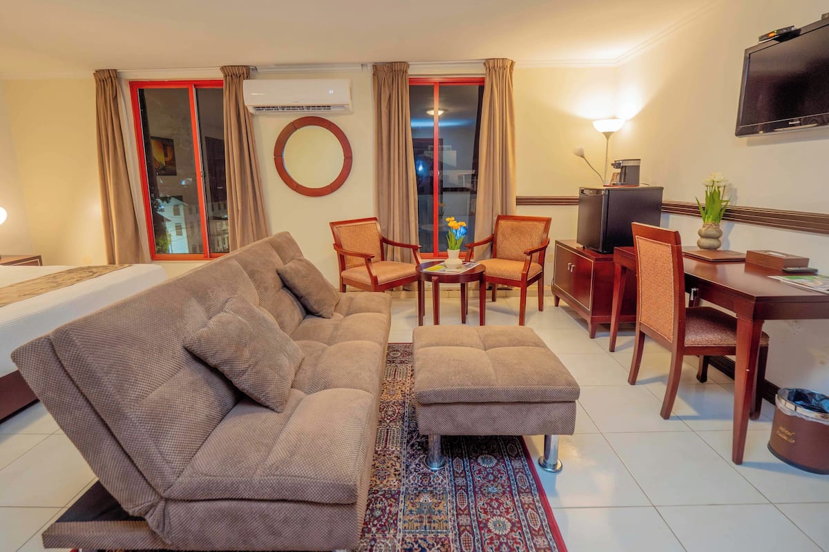 Premium Room, 1 King Bed, City View | In-room safe, desk, laptop workspace, blackout drapes