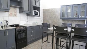 Superior Suite Self Catering 2 Bedroom Flat | Private kitchen | Fridge, microwave, coffee/tea maker, electric kettle