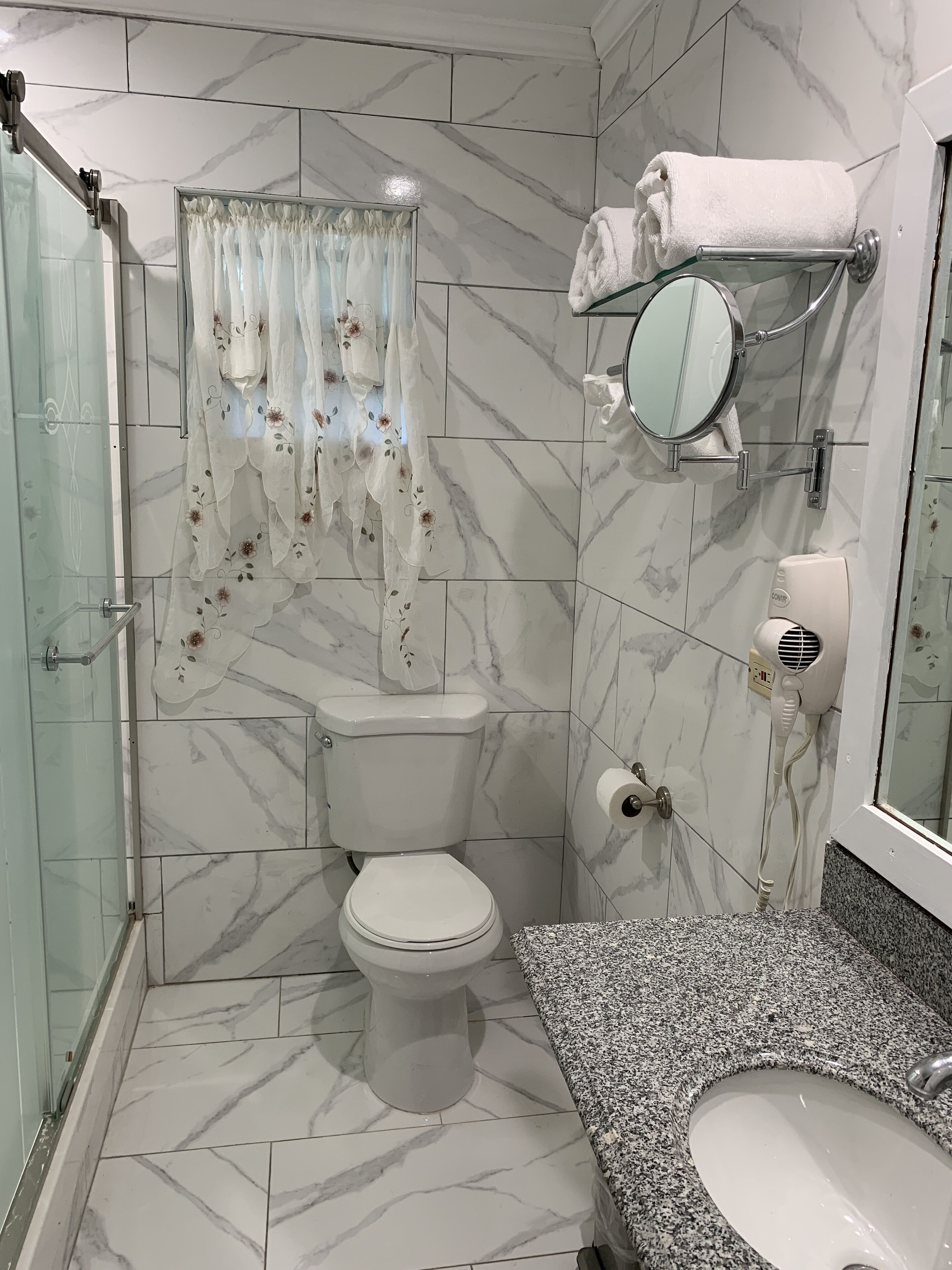 apartment | bathroom | designer toiletries, hair dryer, towels, soap