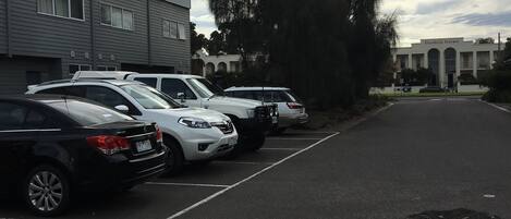 A parking lot with several cars parked in front of a building labeled "Elizabeth Terrace."