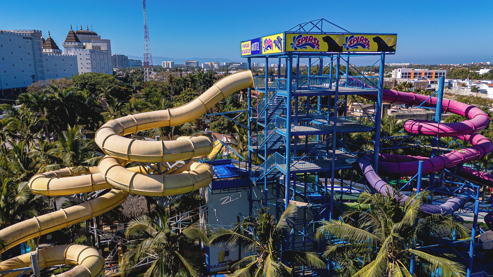 A water park with multiple water slides and a tower structure.