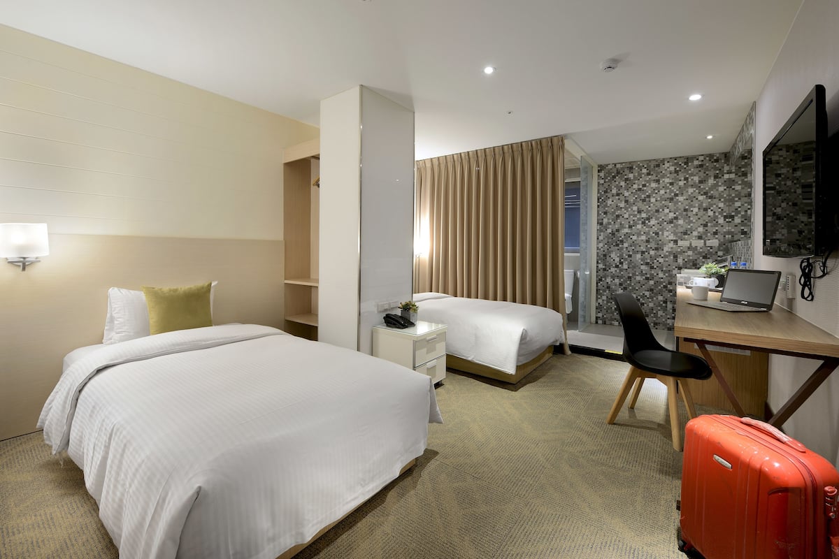 Down duvets, pillow-top beds, in-room safe, desk
