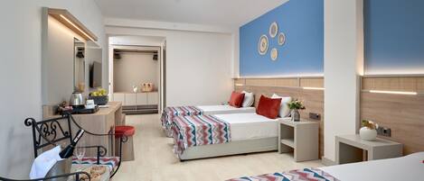 A modern hotel room with two beds, a desk, a chair, and a mirror.