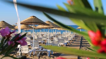 Private beach, free beach shuttle, free beach cabanas, sun loungers