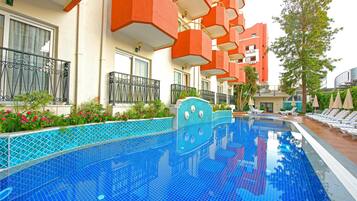 2 outdoor pools, pool umbrellas, pool loungers