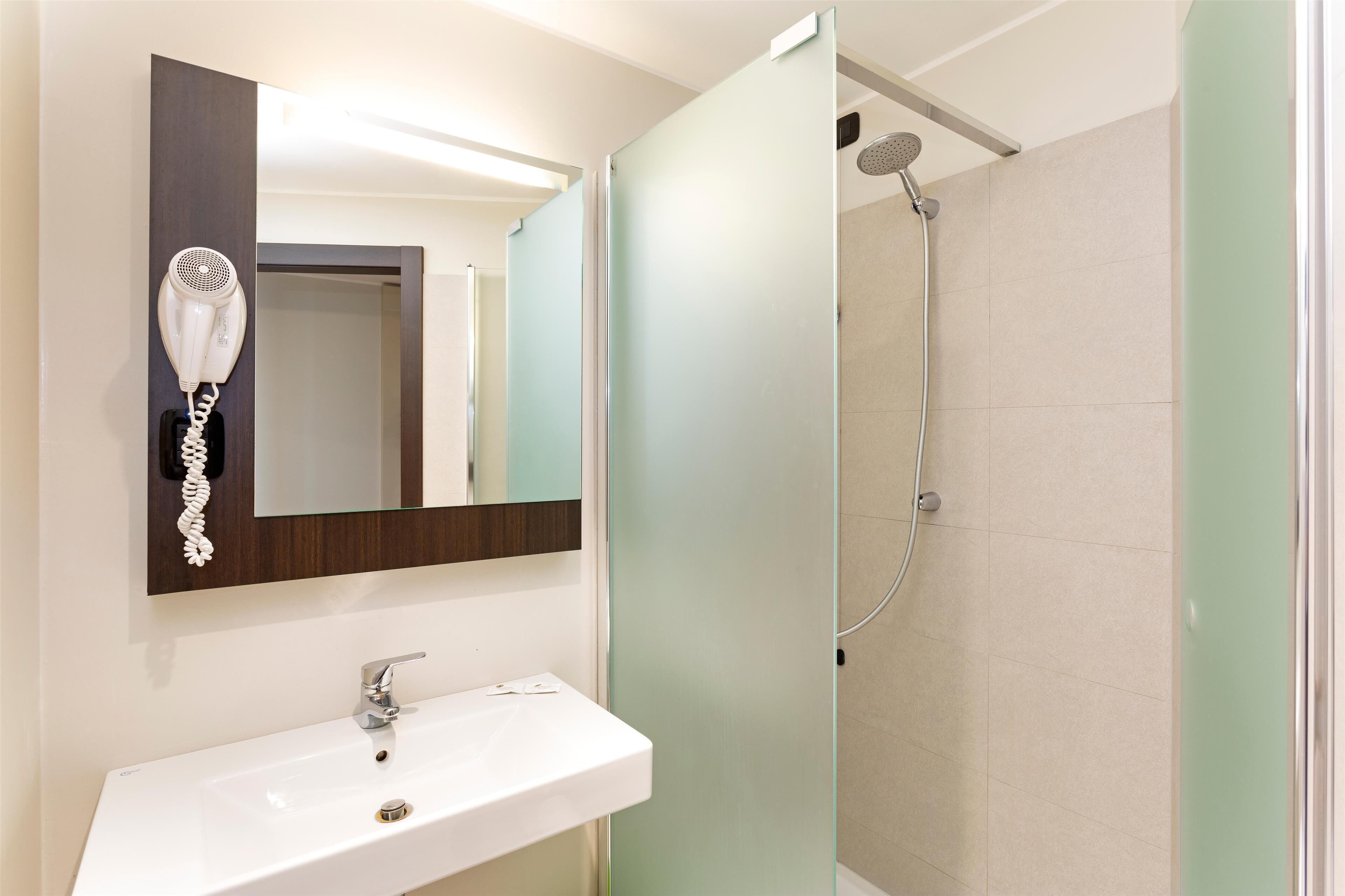 shower, hair dryer, bidet, towels