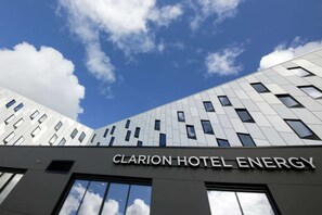The exterior of Clarion Hotel Energy with a modern architectural design, featuring a prominent sign and large windows. - Clarion Hotel Energy (Stavanger)