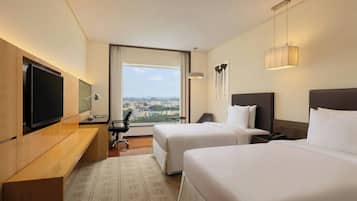 Premium bedding, down comforters, pillowtop beds, minibar