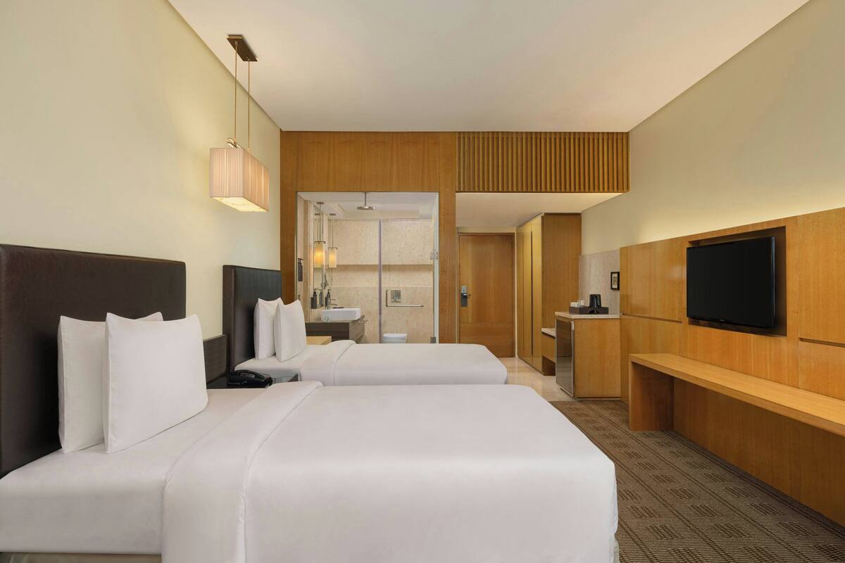 Luxe beddengoed, donsdekens, pillowtop-bedden, een minibar