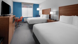 A hotel room with two beds, a desk with a chair, a TV, a lamp, and a window with blinds. - Holiday Inn Express & Suites Midland South I-20 by IHG (Midland)