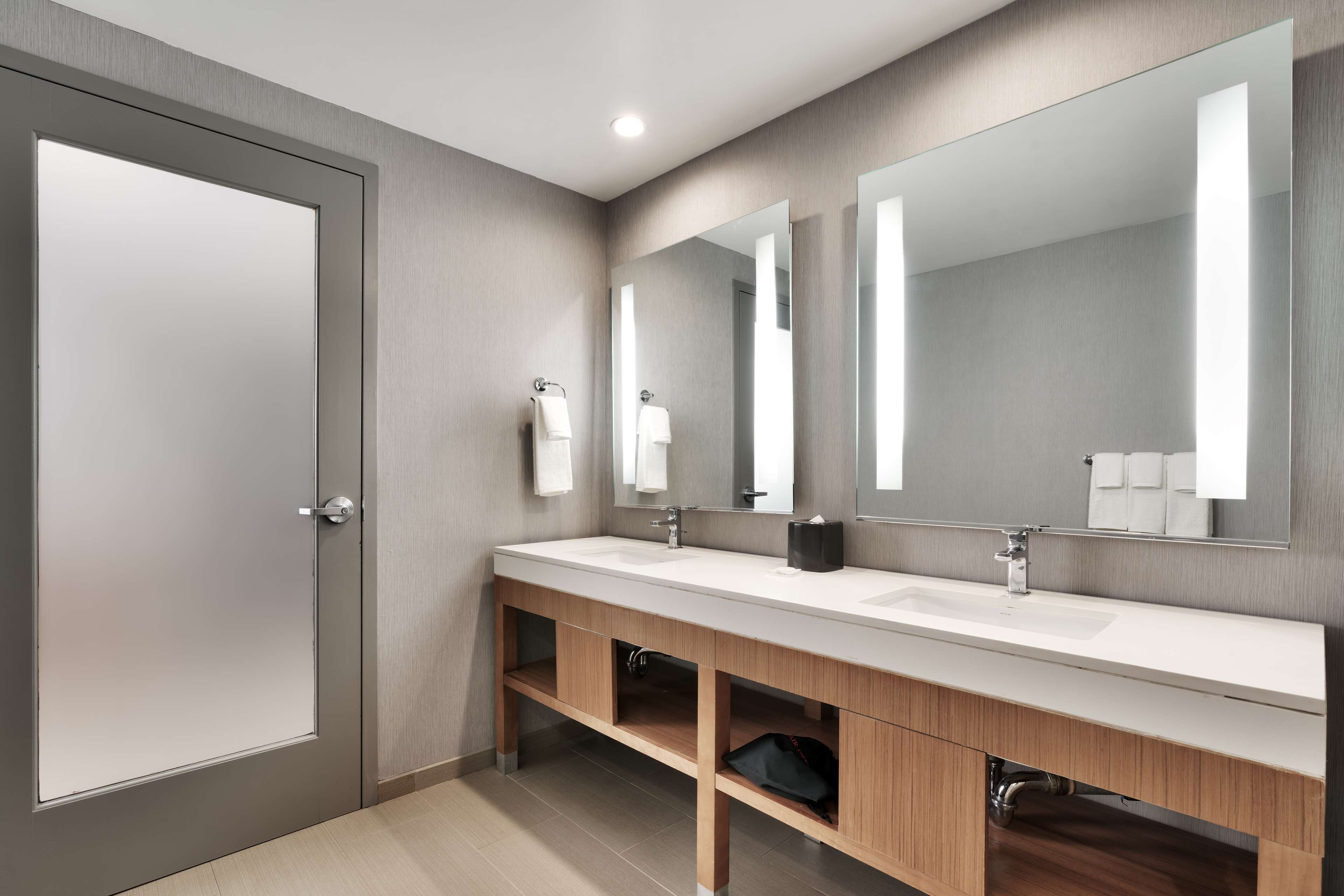 designer toiletries, hair dryer, towels