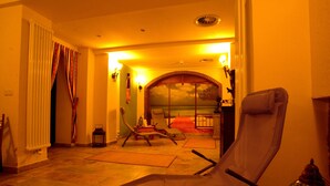 A room with a large window, a chair, a radiator, and a lamp. - Hotel Arena City (Leipzig)