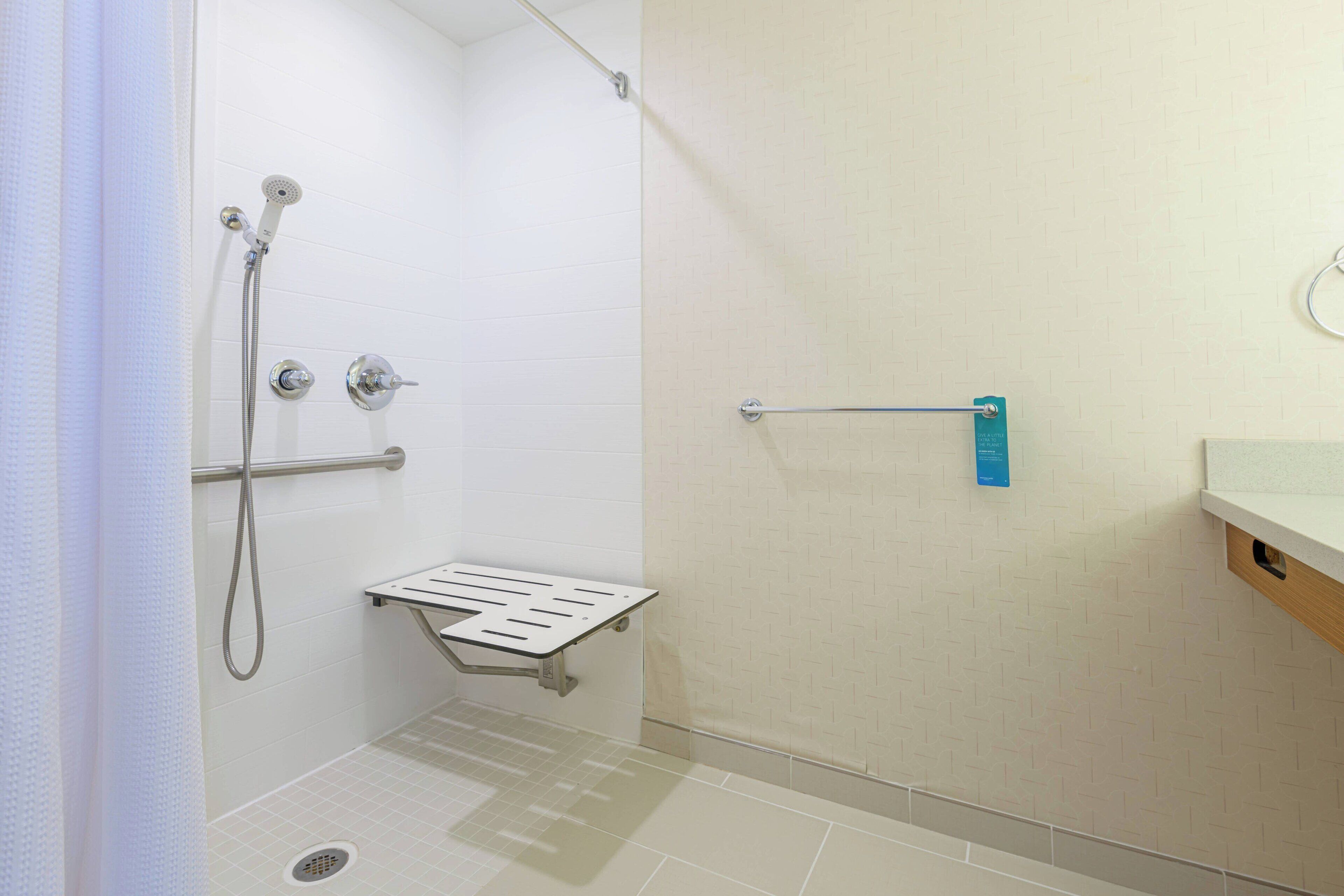 combined shower/bathtub, designer toiletries, hair dryer, towels