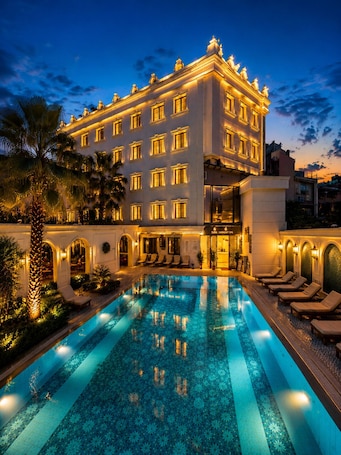 A hotel with a swimming pool, multiple balconies, and a spa area.. Sura Hagia Sophia Hotel