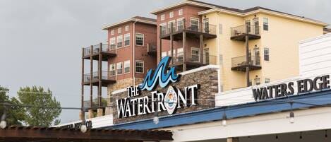 A multi-story building with a sign reading "The Waterfront."