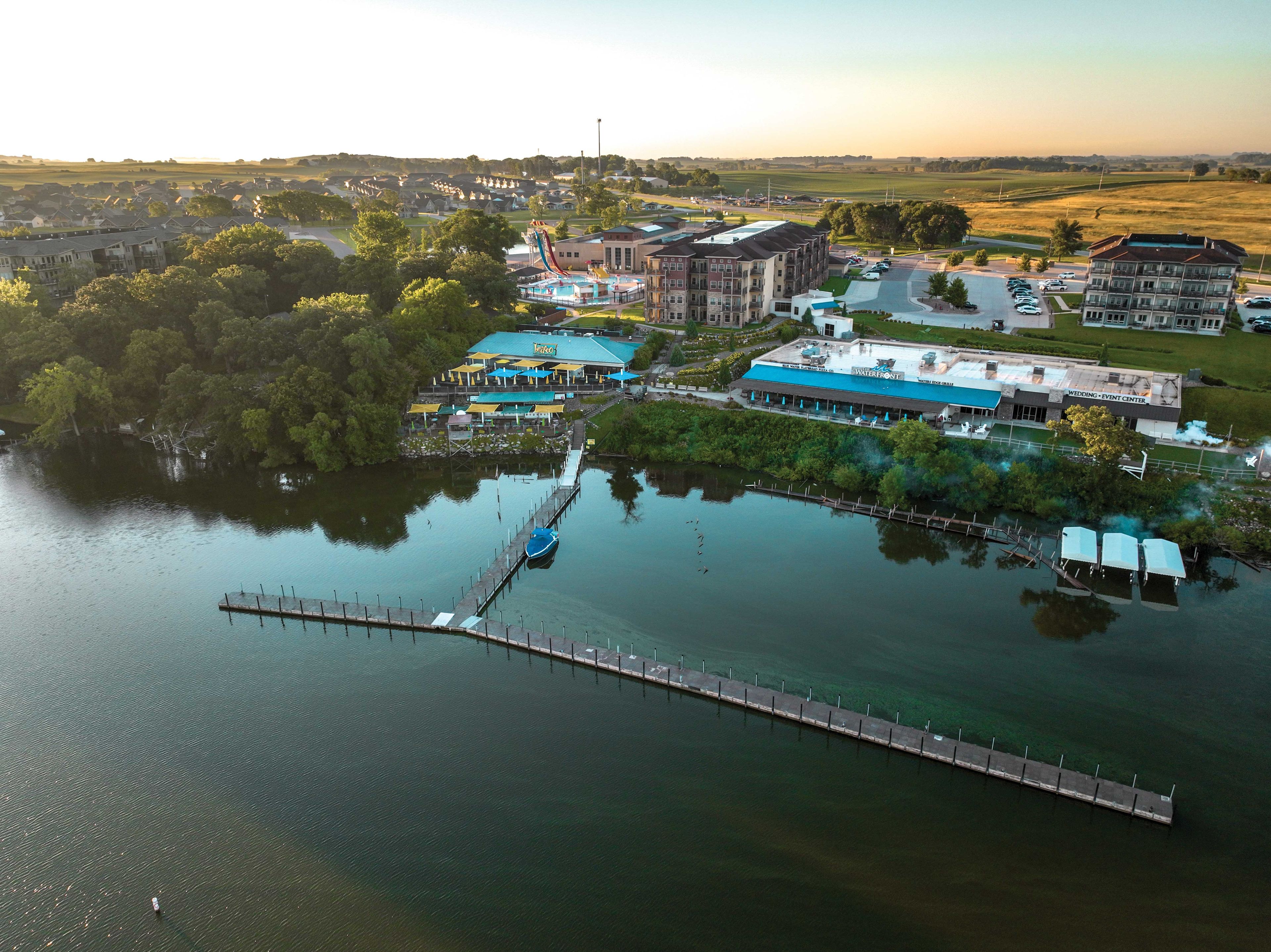 A waterfront property with a dock, a restaurant, and a wedding event center.
