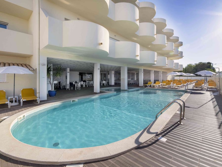 Outdoor pool, open 9 AM to 6:00 PM, pool umbrellas, sun loungers