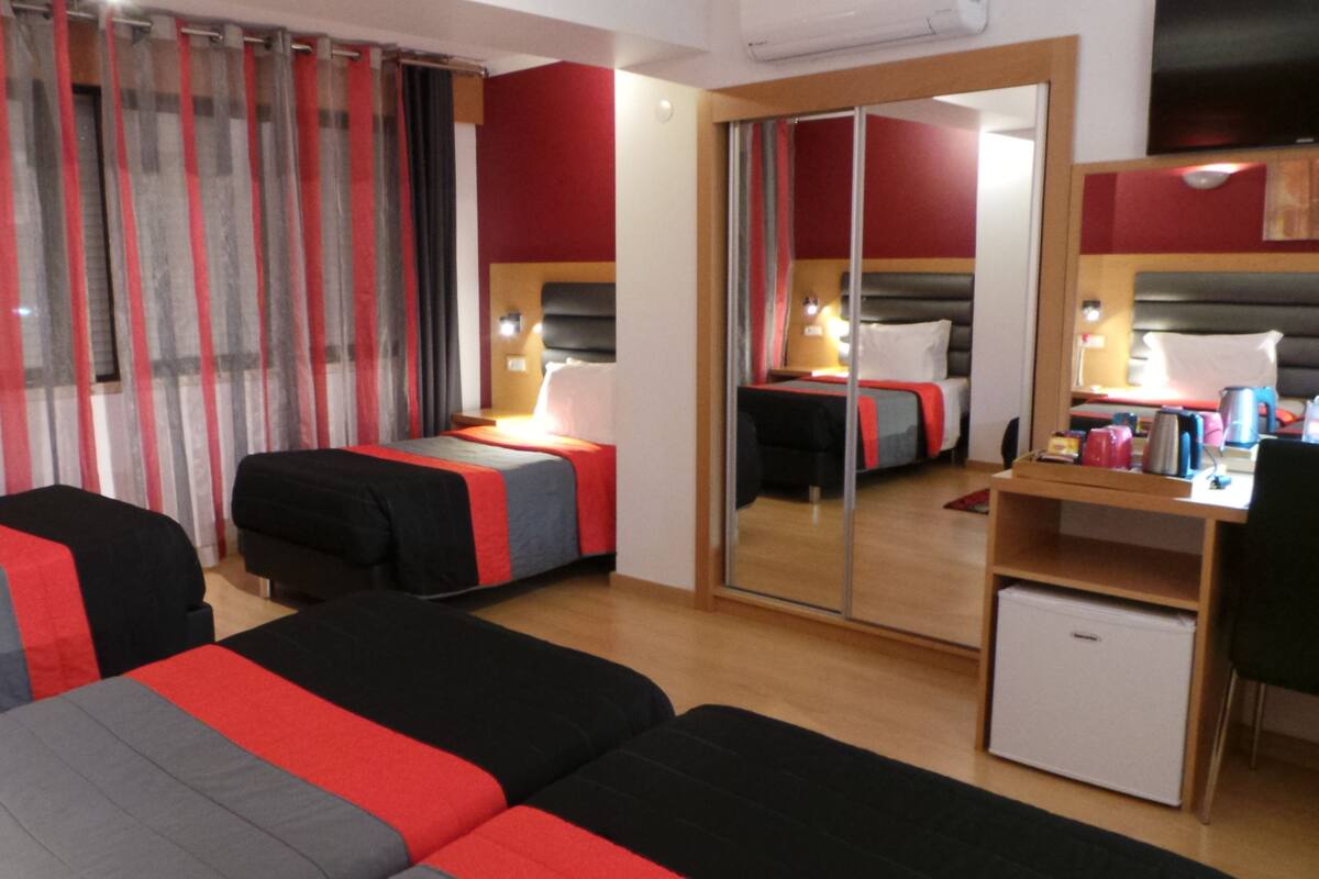 Family Quadruple Room | In-room safe, desk, blackout drapes, iron/ironing board