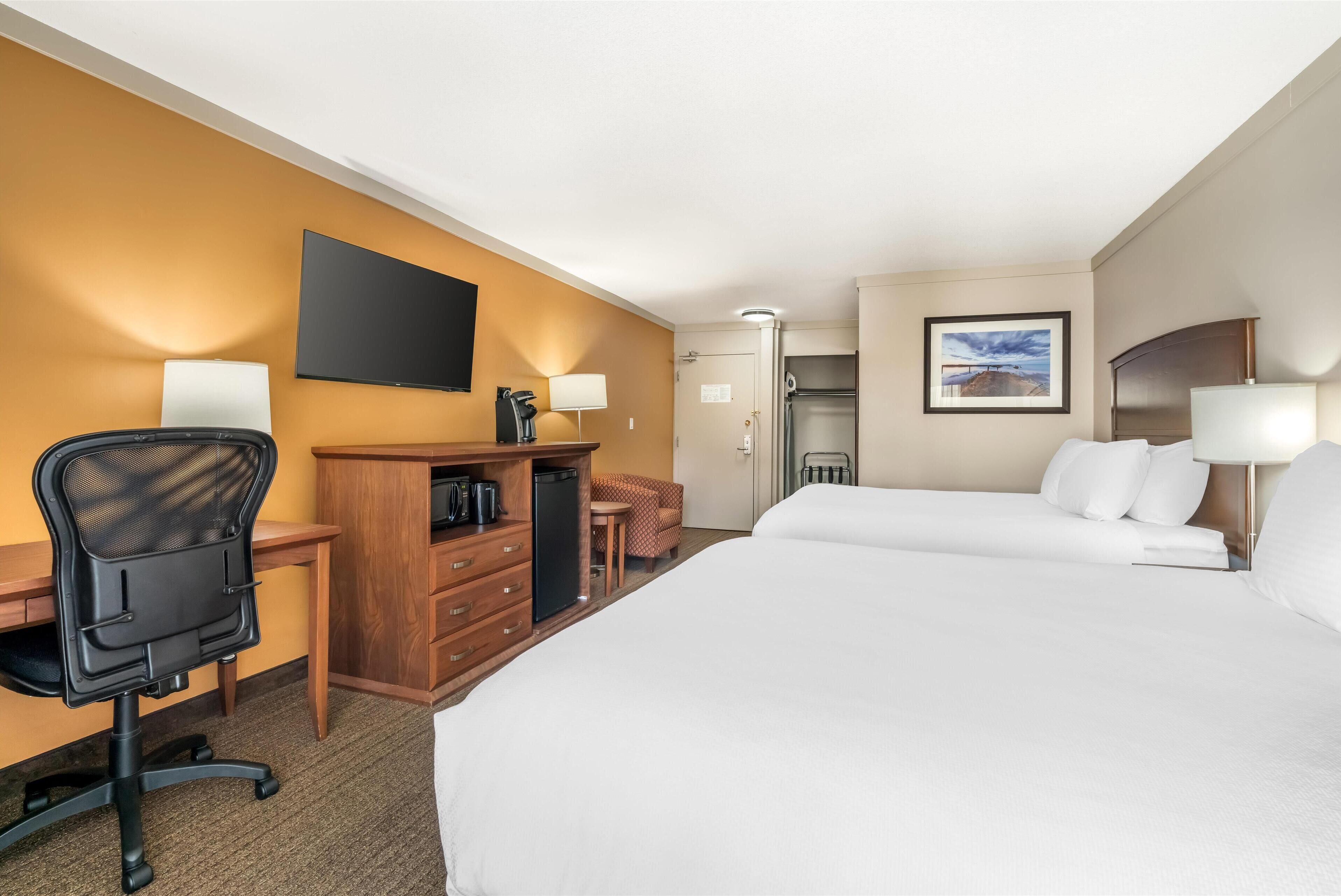 standard room, 2 queen beds, non smoking, balcony (pet friendly) | desk, laptop workspace, iron/ironing board, free cots/infant beds