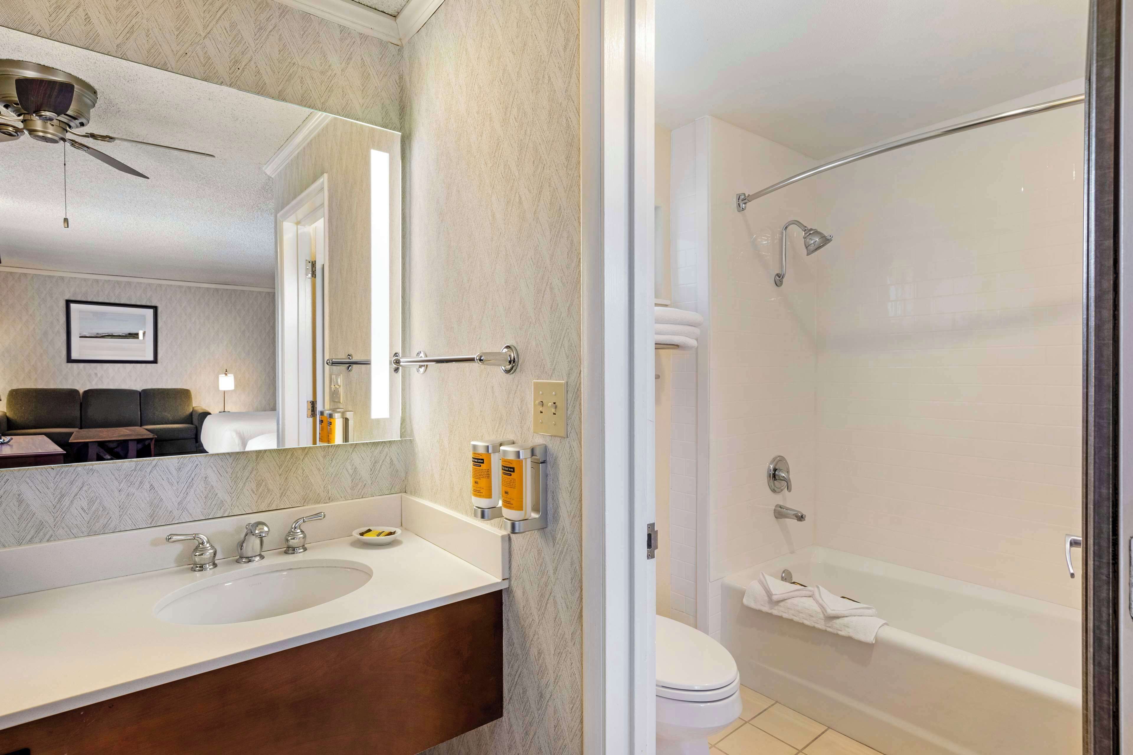 Family Room, 2 Queen Beds, Non Smoking (Third bed is a Sofabed) | Bathroom | Combined shower/tub, hydromassage showerhead, eco-friendly toiletries