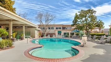 Outdoor pool, open 9:00 AM to 10:00 PM, pool umbrellas, pool loungers