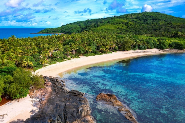 On the beach, white sand, beach towels, scuba diving