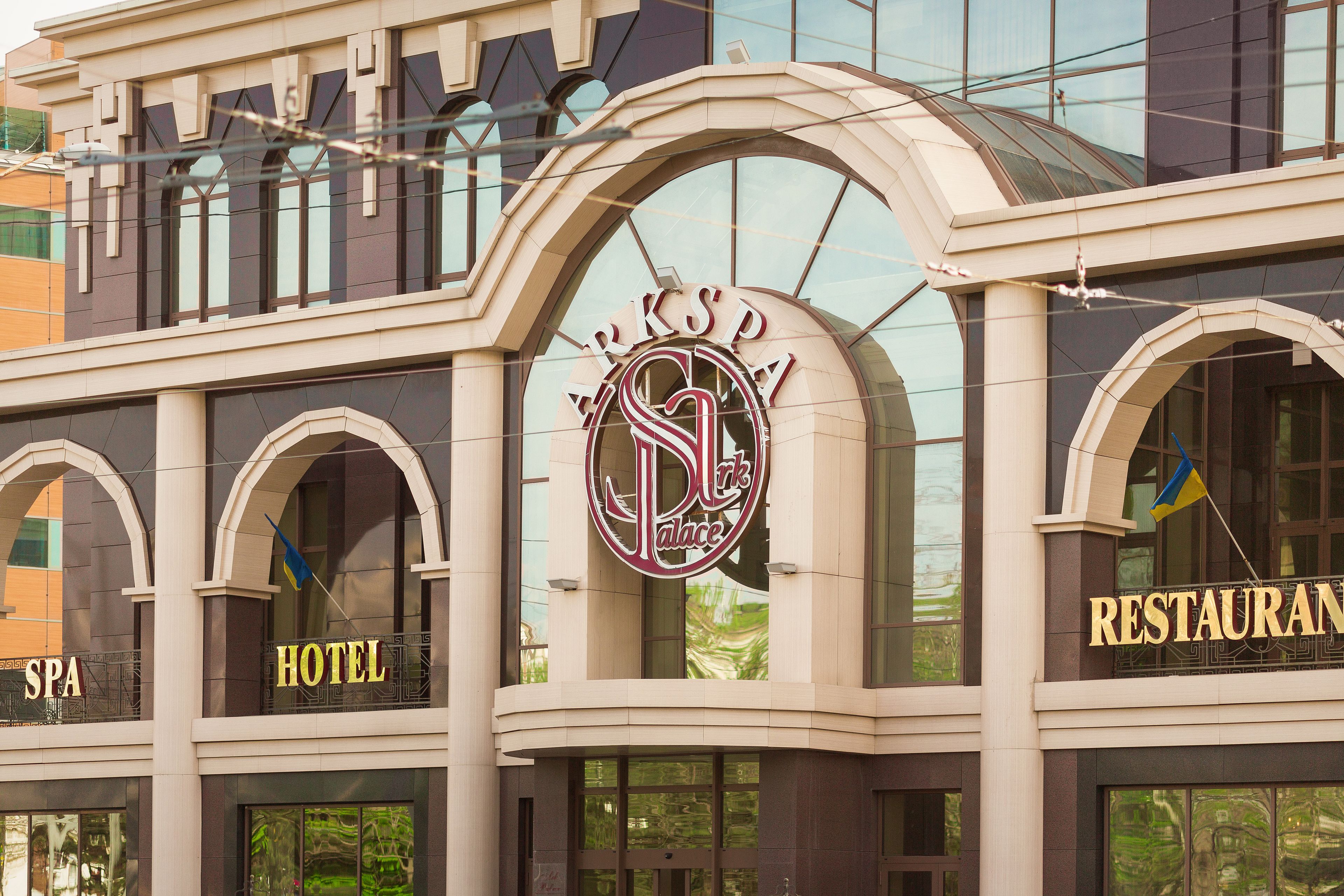 A building with signs for SPA, HOTEL, and RESTAURANT.
