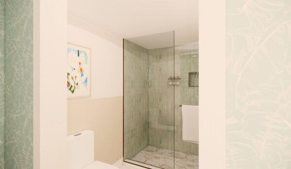 Un baño moderno con cabina de ducha de vidrio, un inodoro y una obra de arte enmarcada en la pared.
