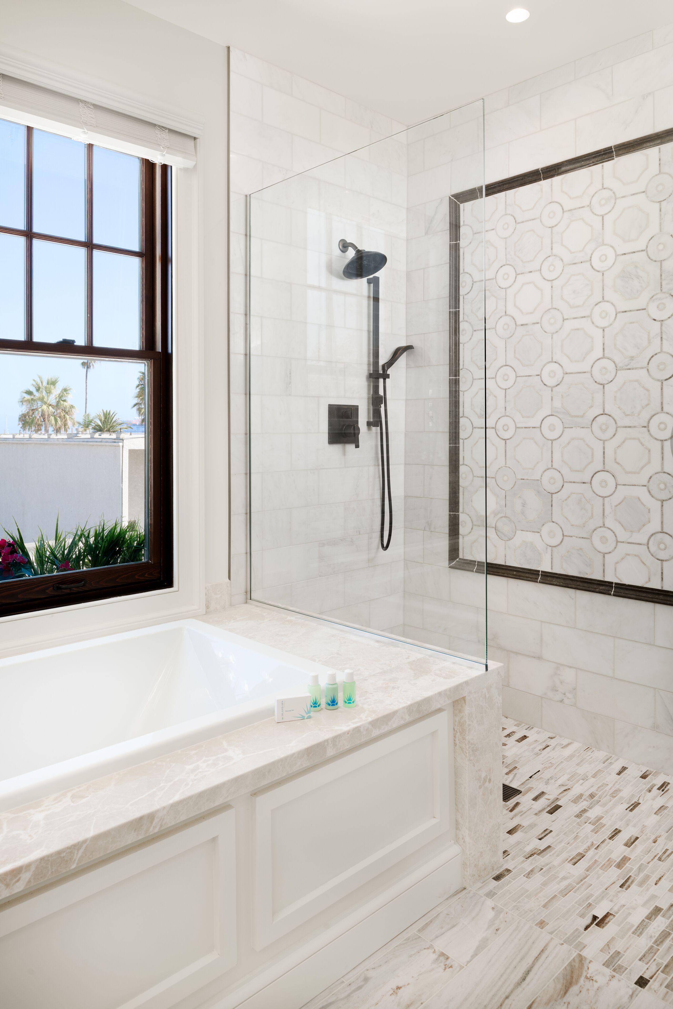 Shower, designer toiletries, hair dryer, towels