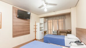 A hotel room with two beds, a television, a ceiling fan, a wardrobe, and a desk with a telephone. - Letto Hotel Porto Alegre (Porto Alegre)