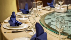 A table set for dining with plates, glasses, and cutlery. - Leeden Hotel Chengdu (Chengdu)