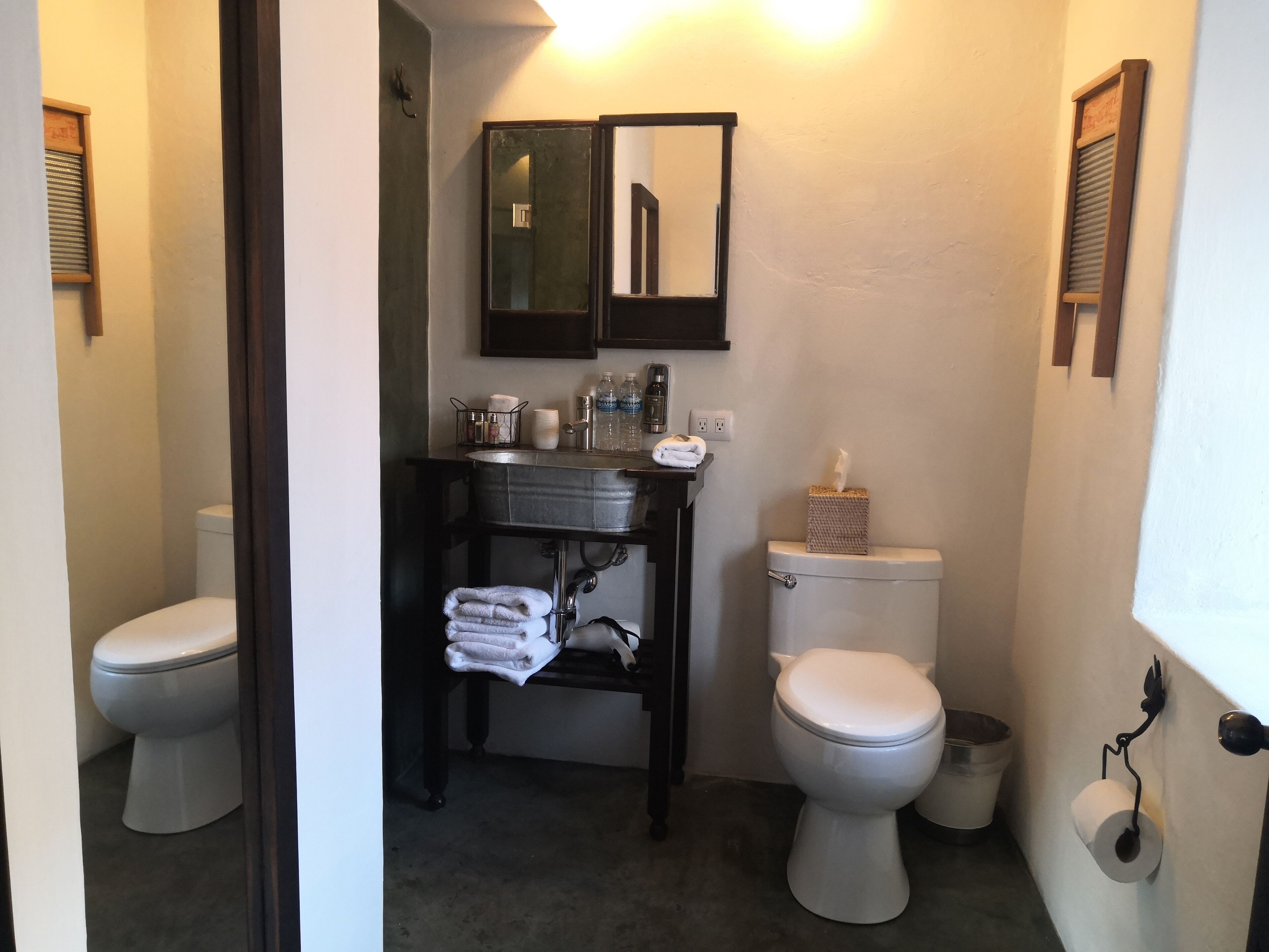 designer toiletries, hair dryer, towels