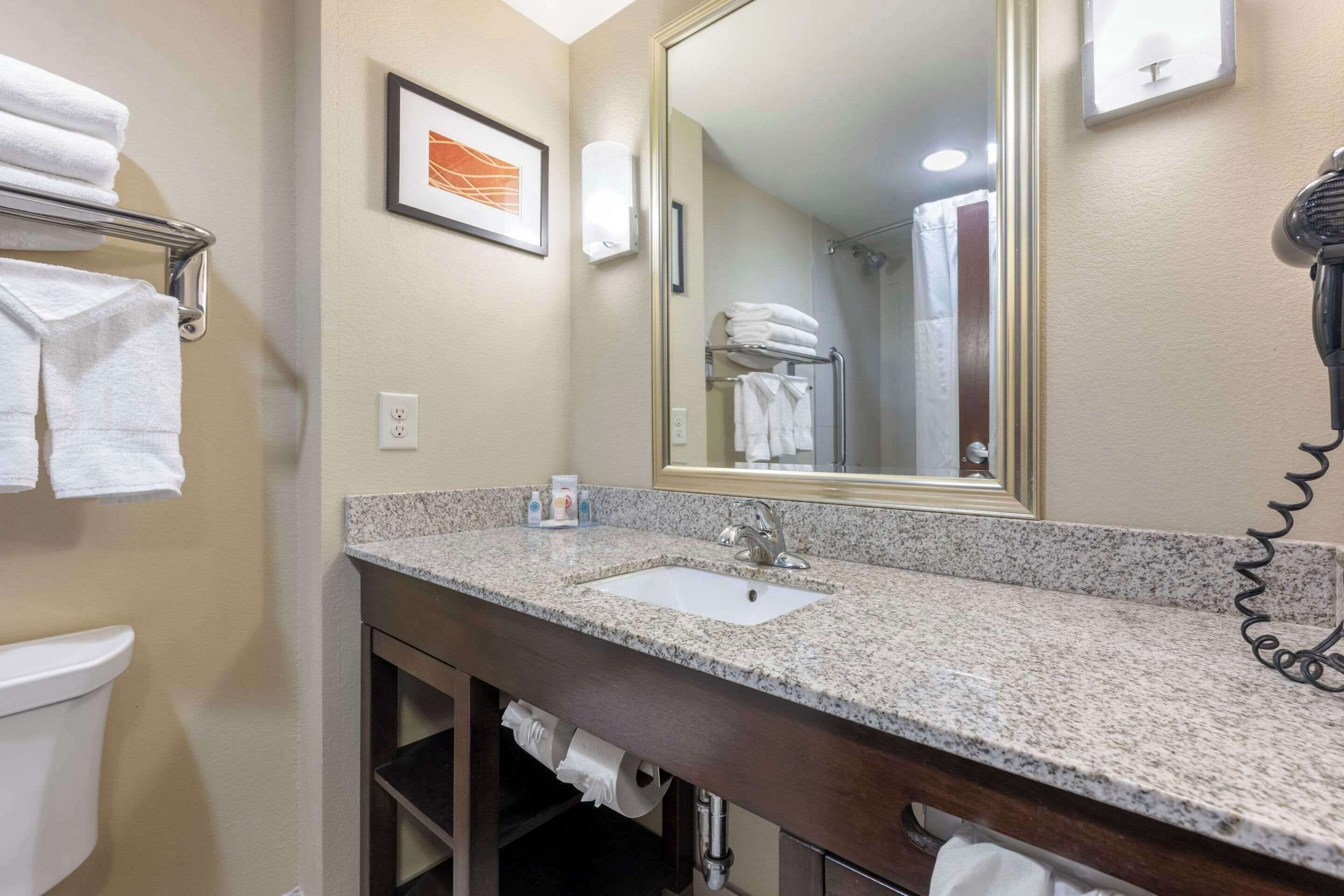 premium bedding, pillow-top beds, desk, laptop workspace