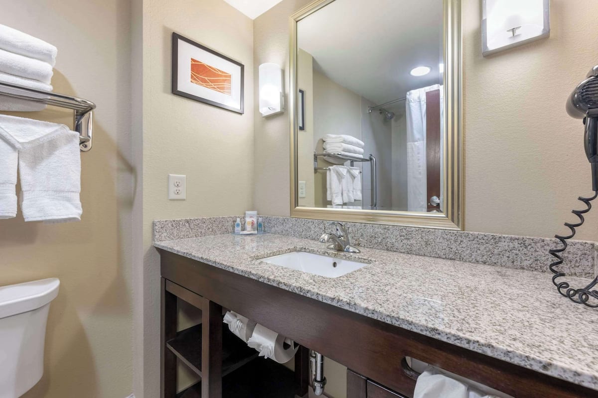 premium bedding, pillow-top beds, desk, laptop workspace