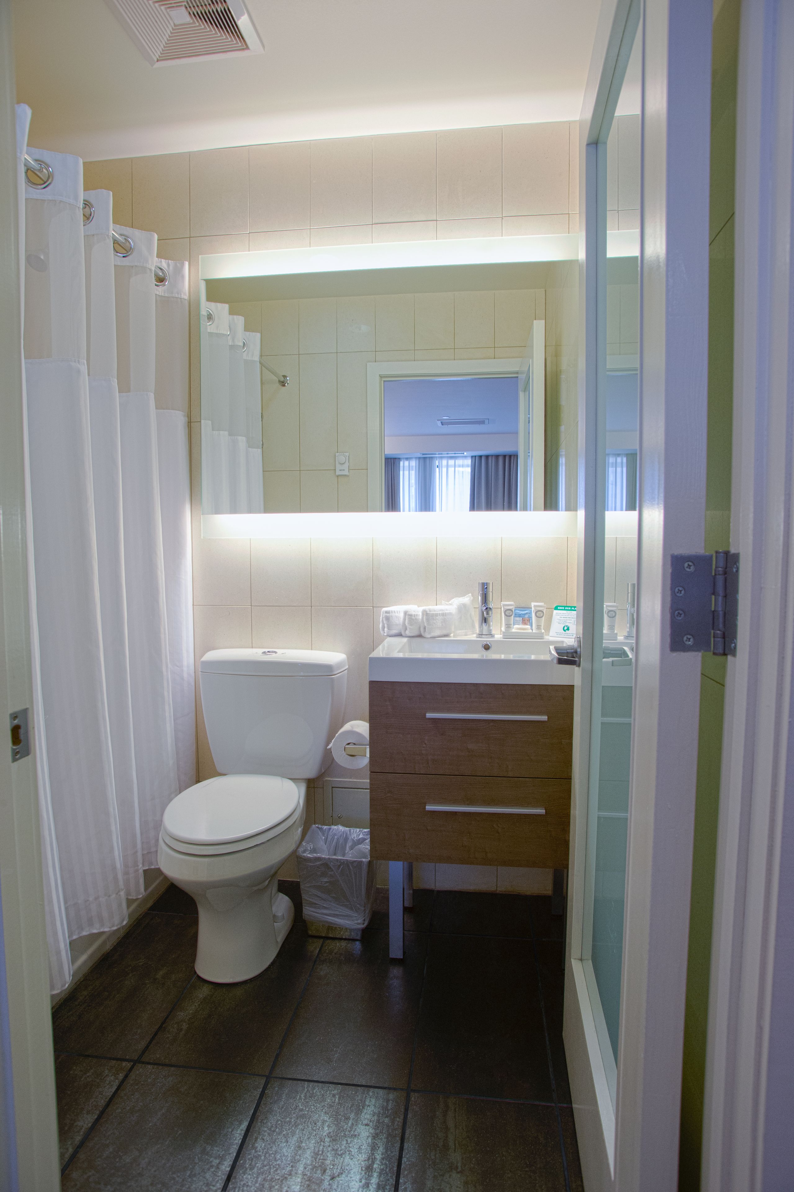 shower, rainfall showerhead, hair dryer, slippers