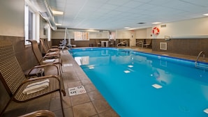 A pool area with lounge chairs, a lifeguard sign, and a no diving warning sign. - Best Western Inn (Elyria)