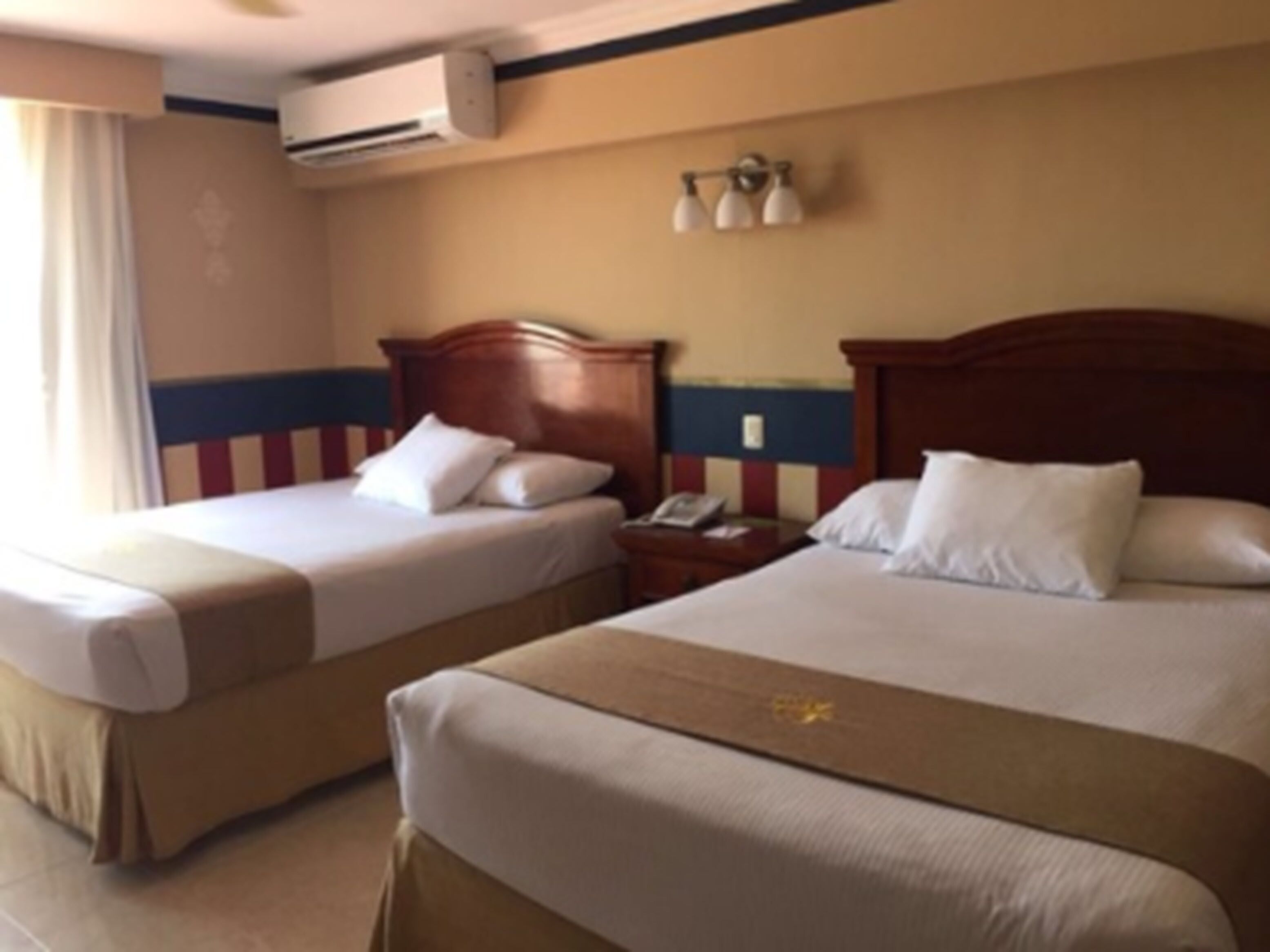 standard room, 2 double beds | 1 bedroom, in-room safe, desk, blackout curtains