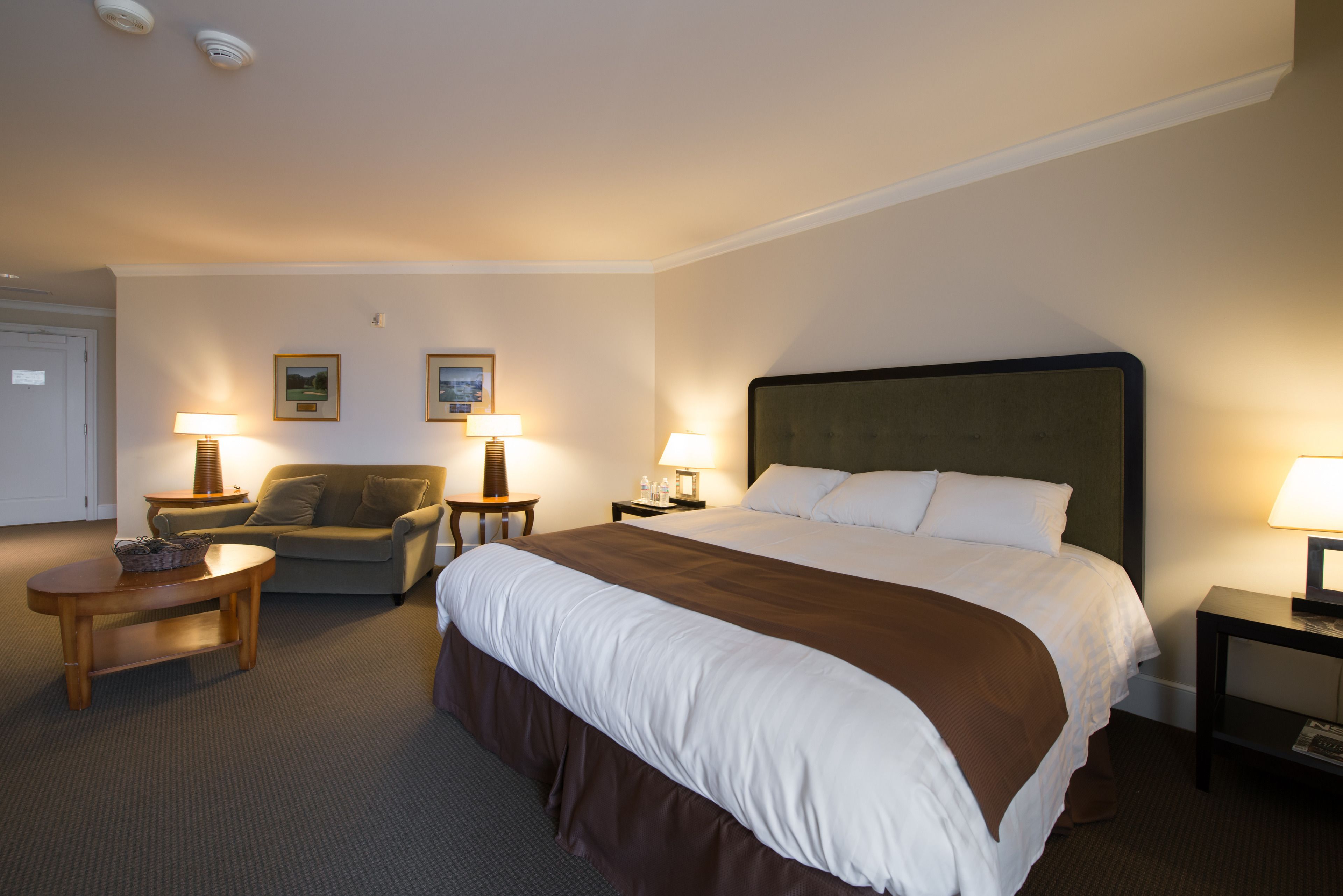 luxury suite, 1 king bed, balcony, golf view | premium bedding, desk, iron/ironing board, travel cot