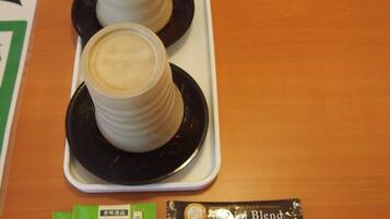Two coffee cups on a tray, a clock, and a packet labeled "Special Blend".