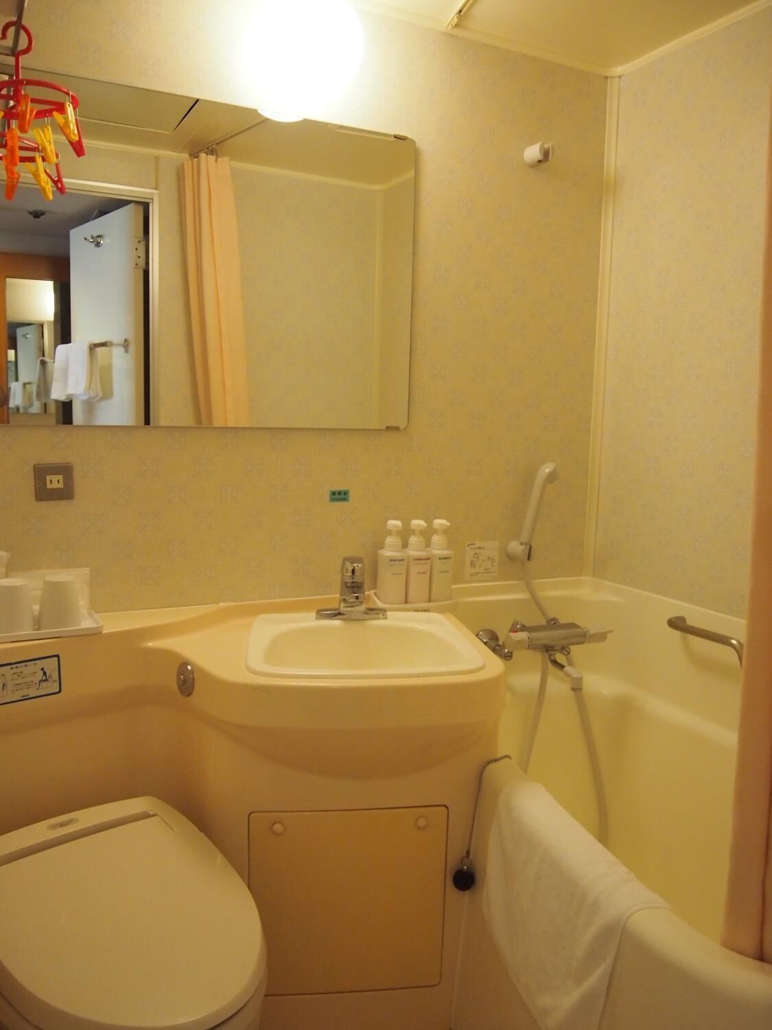 combined shower/bathtub, deep-soaking bathtub, hair dryer, slippers
