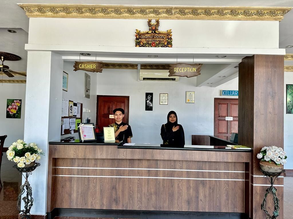 A reception desk with a sign reading "CASHIER" and "RECEPTION".
