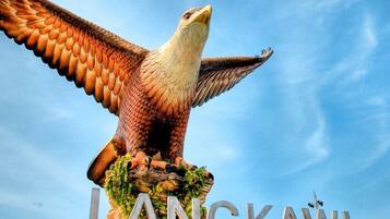 A large eagle statue with the text "LANGKAWI" at its base.