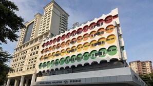 A hotel with a distinctive multi-colored facade and a prominent entrance. - Hotel Regal Malaysia (George Town)