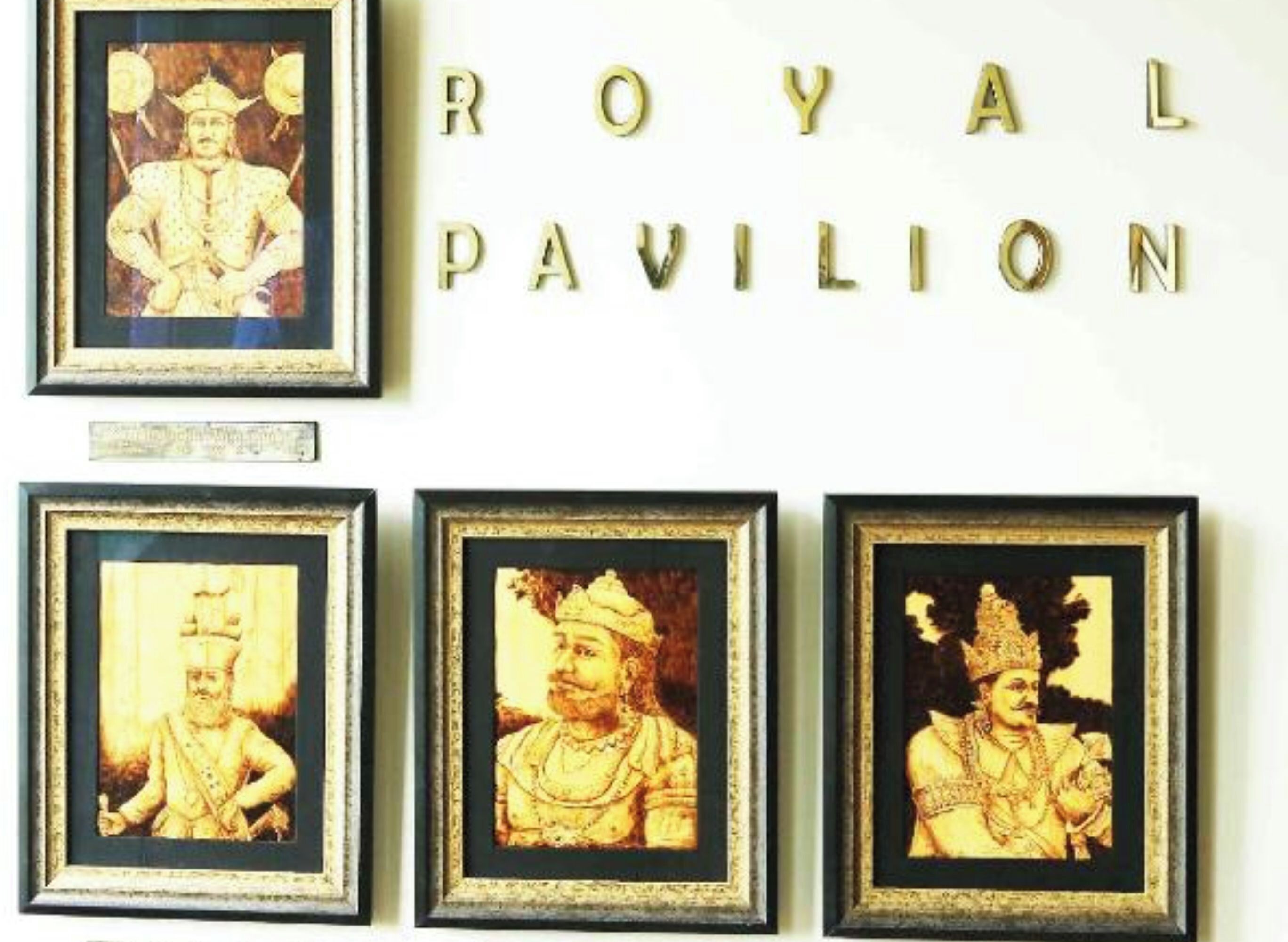 Framed pictures of historical figures and the text "ROYAL PAVILION".